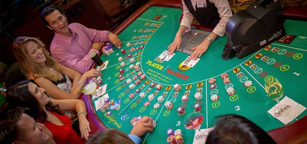 casino table with dealer and players, with chips and cards on table
