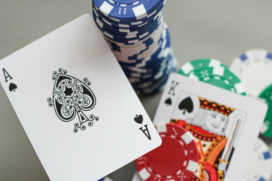 Ace and king of spades with casino chips