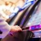 a man at playing at a slot machine